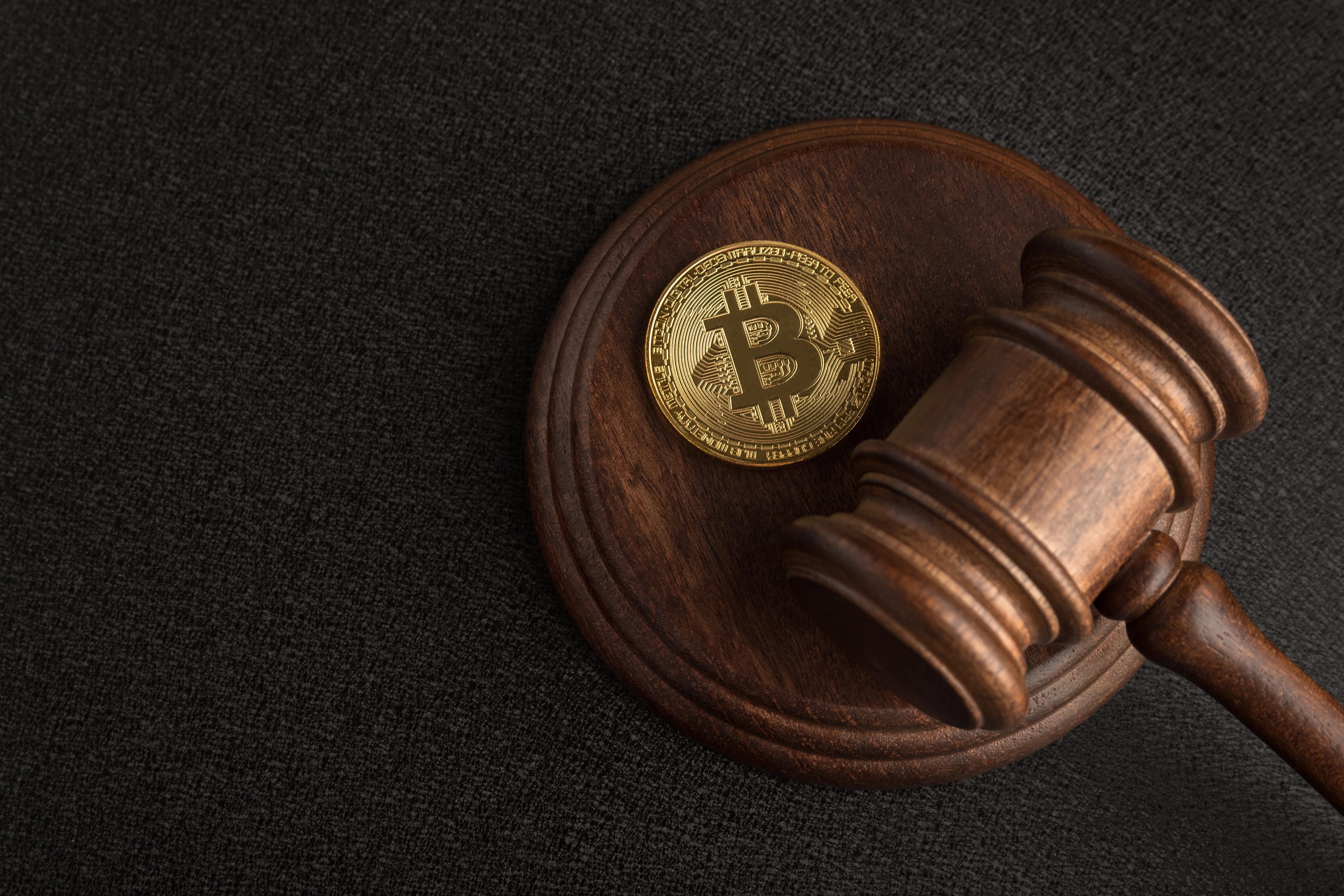 Judge,Gavel,And,Bitcoin.,Cryptocurrency,Legislation.,Bitcoin,Ban.,Violation,Of